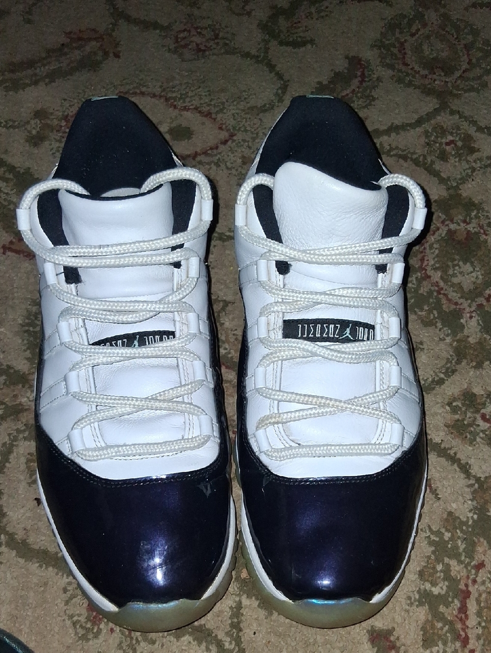 Jordan's  Retro 11 Men's White and Black Low-Top Sneakers with Iridescent Toe